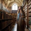 woman exploring thought-provoking books in library