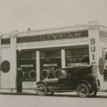 Historic Speck Buick Company dealership with vintage cars parked outside