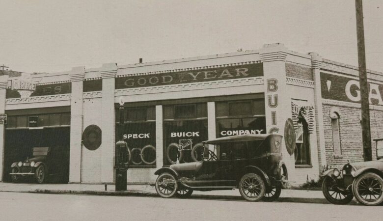 Historic Speck Buick Company dealership with vintage cars parked outside